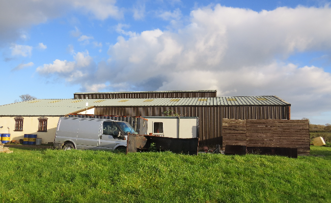 Exterior side view of industrial building.