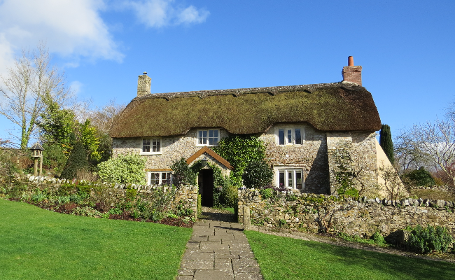 Large detached thatched cottage